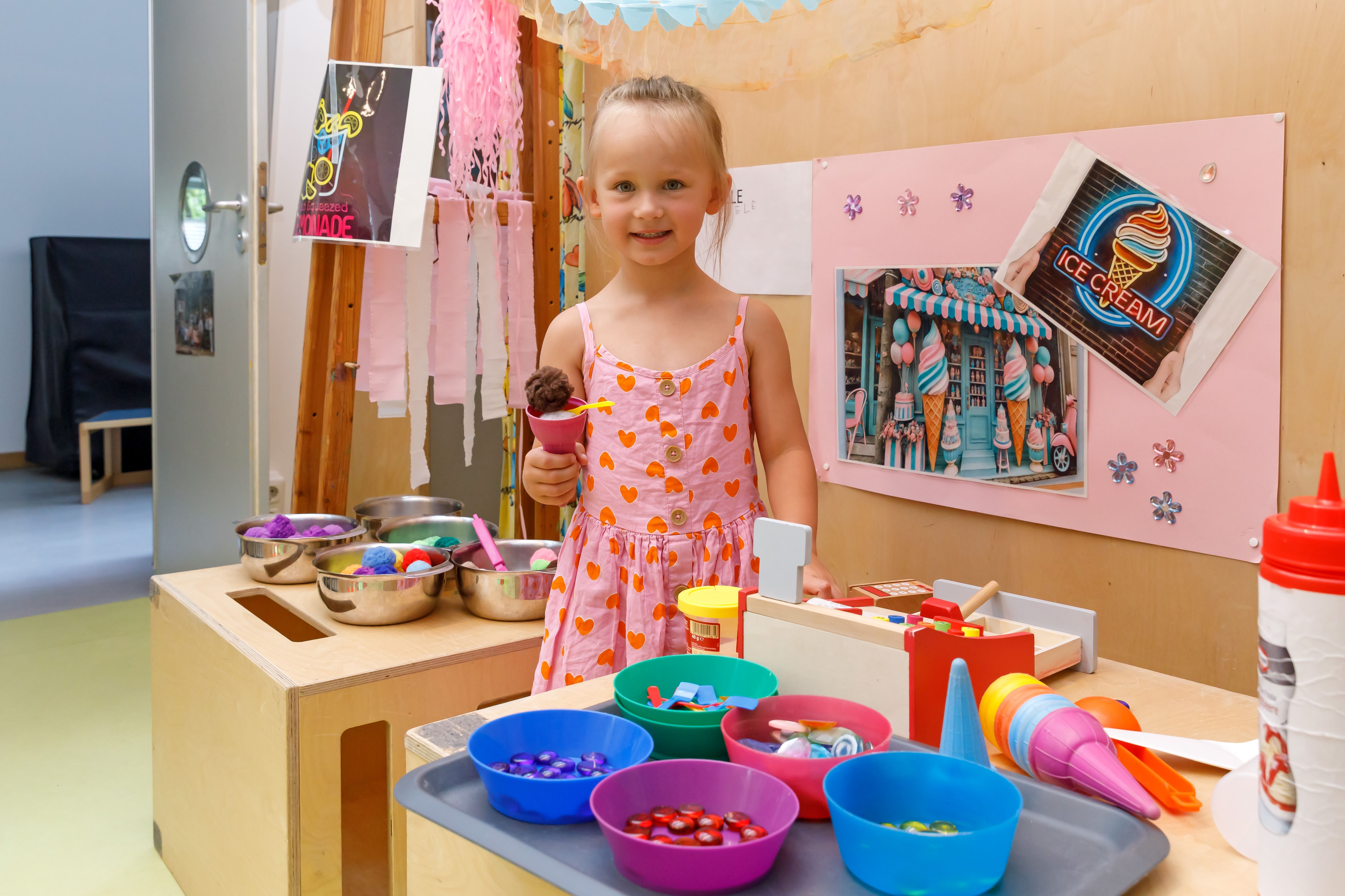 Fotografie: Mädchen in der Spieleecke