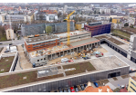 Fotografie - Baustelle mit dem Rohbau und den bereits fertiggestellten Gebäuden (C) Bilddokumentation Stadt Regenburg