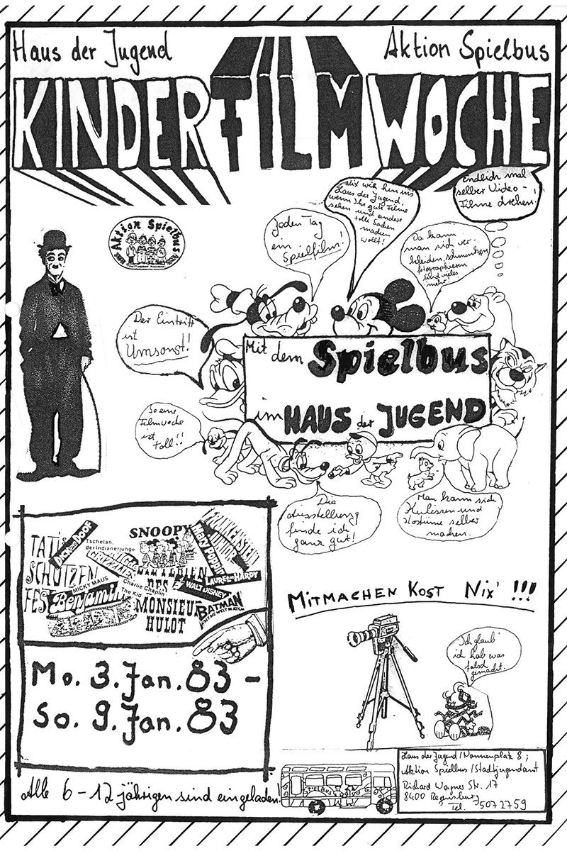 Zu sehen ist ein Flyer im Comicstiel mit Mickey Mouse und Goofe, Charlie Chaplin und Dumbo, der alle 6-12 Jährigen zu der kostenlosen Kinderfilmwoche im Januar 1983 einlädt. Zum einen werden Filme gezeigt, zum andern sind Kinder hier eingeladen selbst einmal einen Video Film zu drehen. 