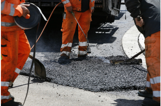 Fotografie- Straßenwärter bei der Arbeit